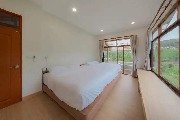 Master bedroom connected to a mountain-view bathtub