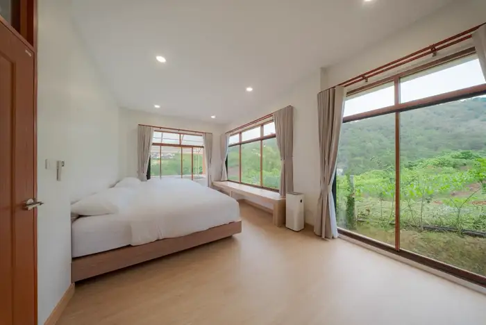 Master bedroom with bathtub visible